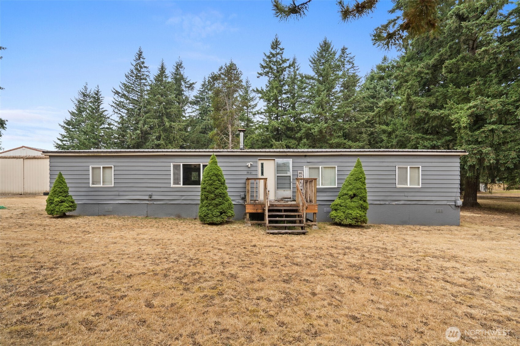 19121 Elderberry Street Southwest Rochester, WA 98579 - Photo 6 of 34 a front view of a house with garden