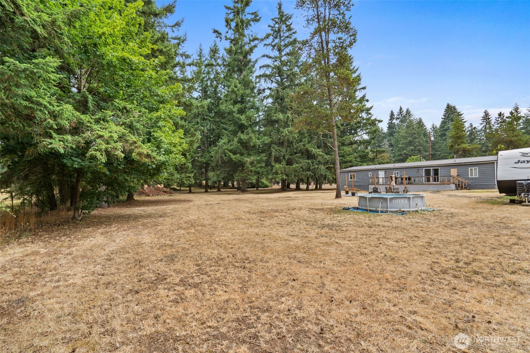 19121 Elderberry Street Southwest Rochester, WA 98579 - Photo 7 of 34 a view of house with trees in the background