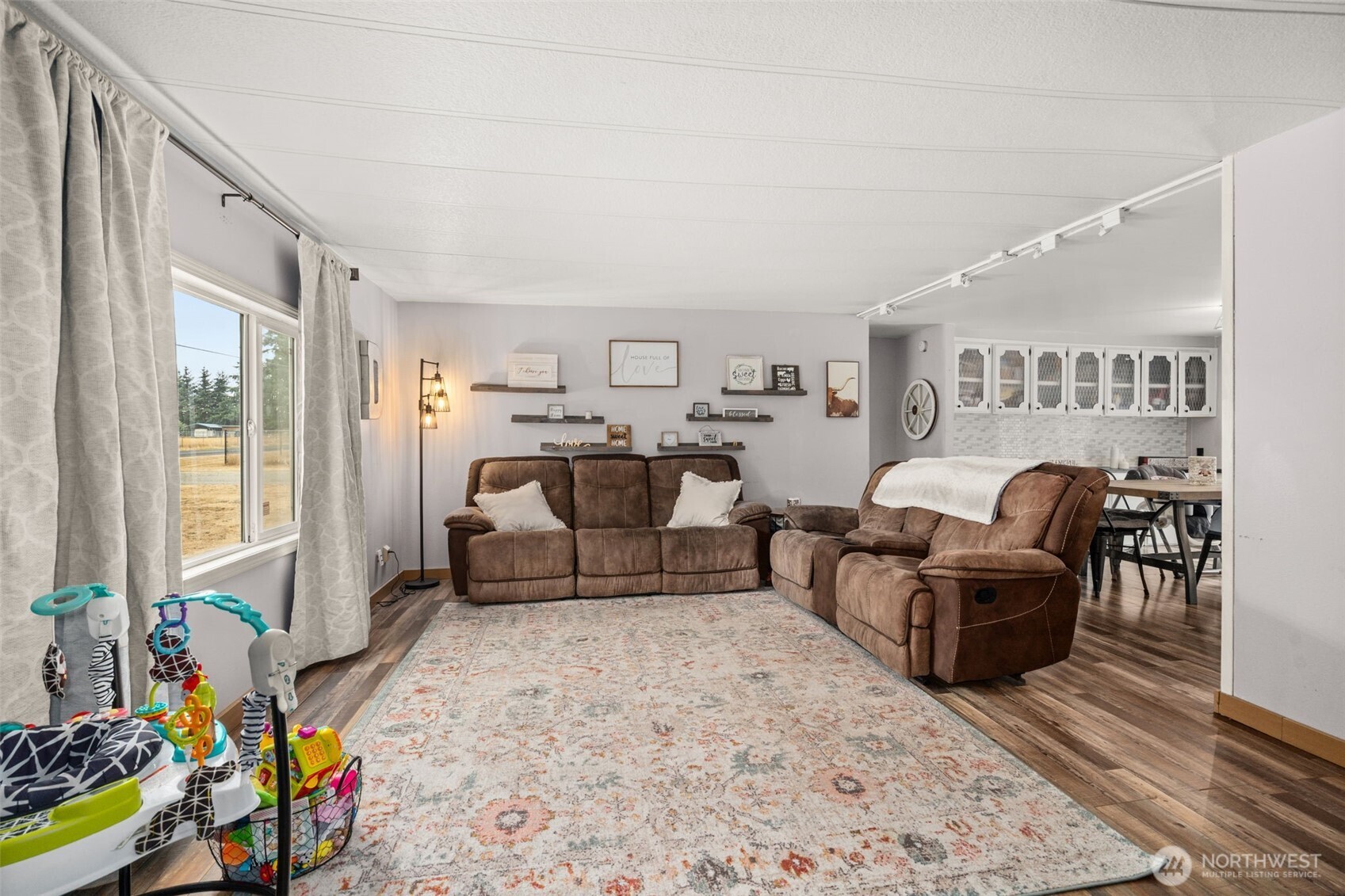 19121 Elderberry Street Southwest Rochester, WA 98579 - Photo 8 of 34 a living room with furniture and a large window
