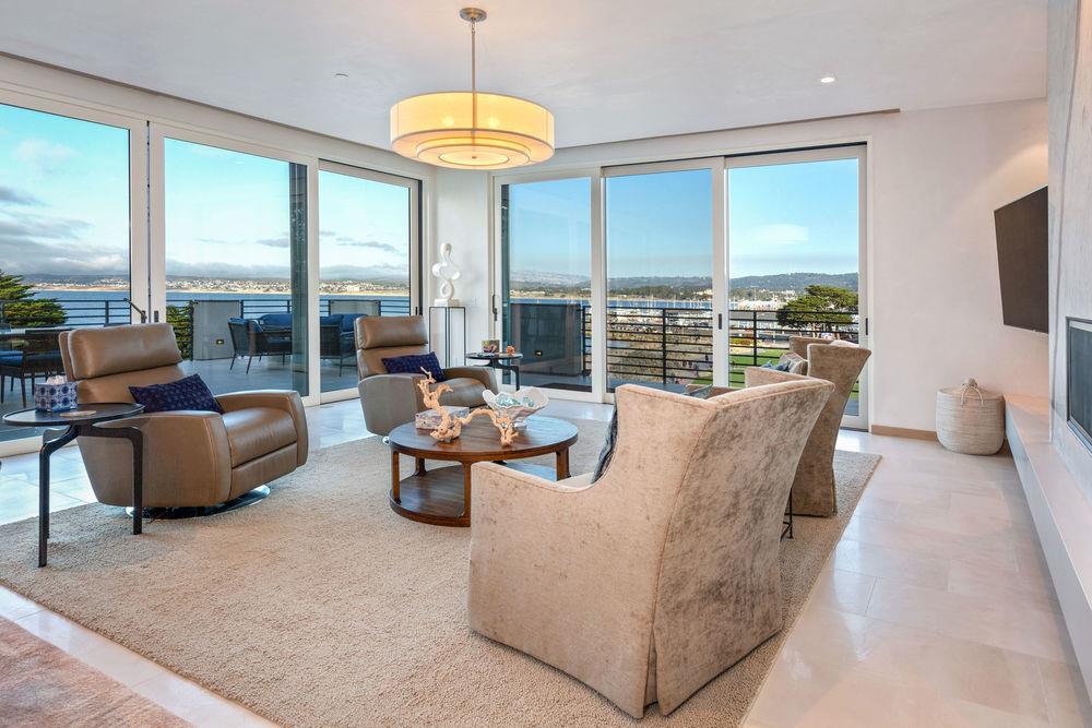201 Cannery Row, Unit 6 Monterey, CA 93940 - Photo 10 of 30 a living room with furniture and a large window