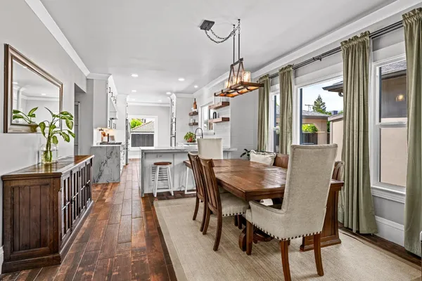 a kitchen with white cabinets and appliances