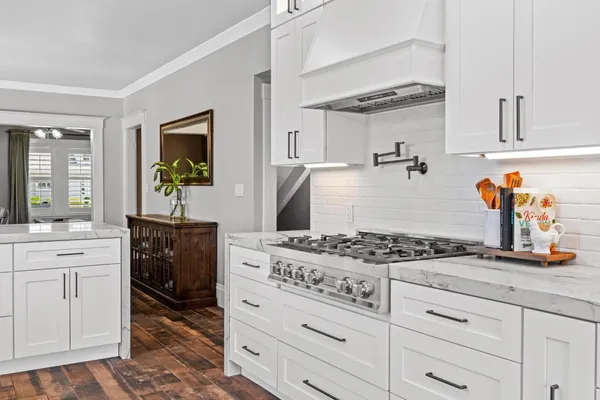 a kitchen with appliances and cabinets