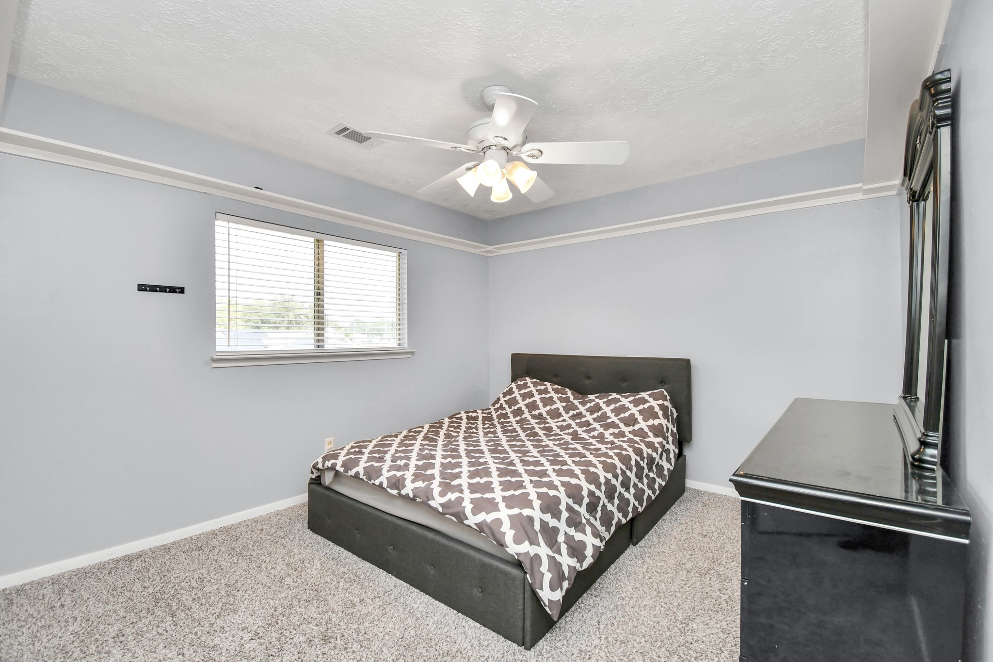 3402 Haydee Road Spring, TX 77388 - Photo 16 of 26 a bedroom with a bed and window