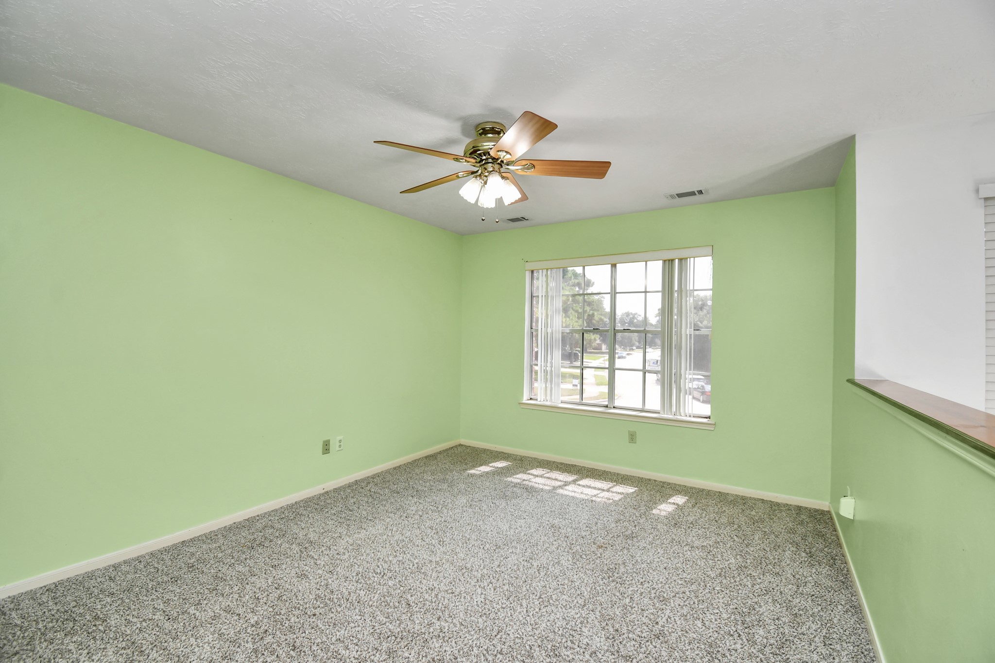 3402 Haydee Road Spring, TX 77388 - Photo 20 of 26 a view of a room that has a window and a ceiling fan