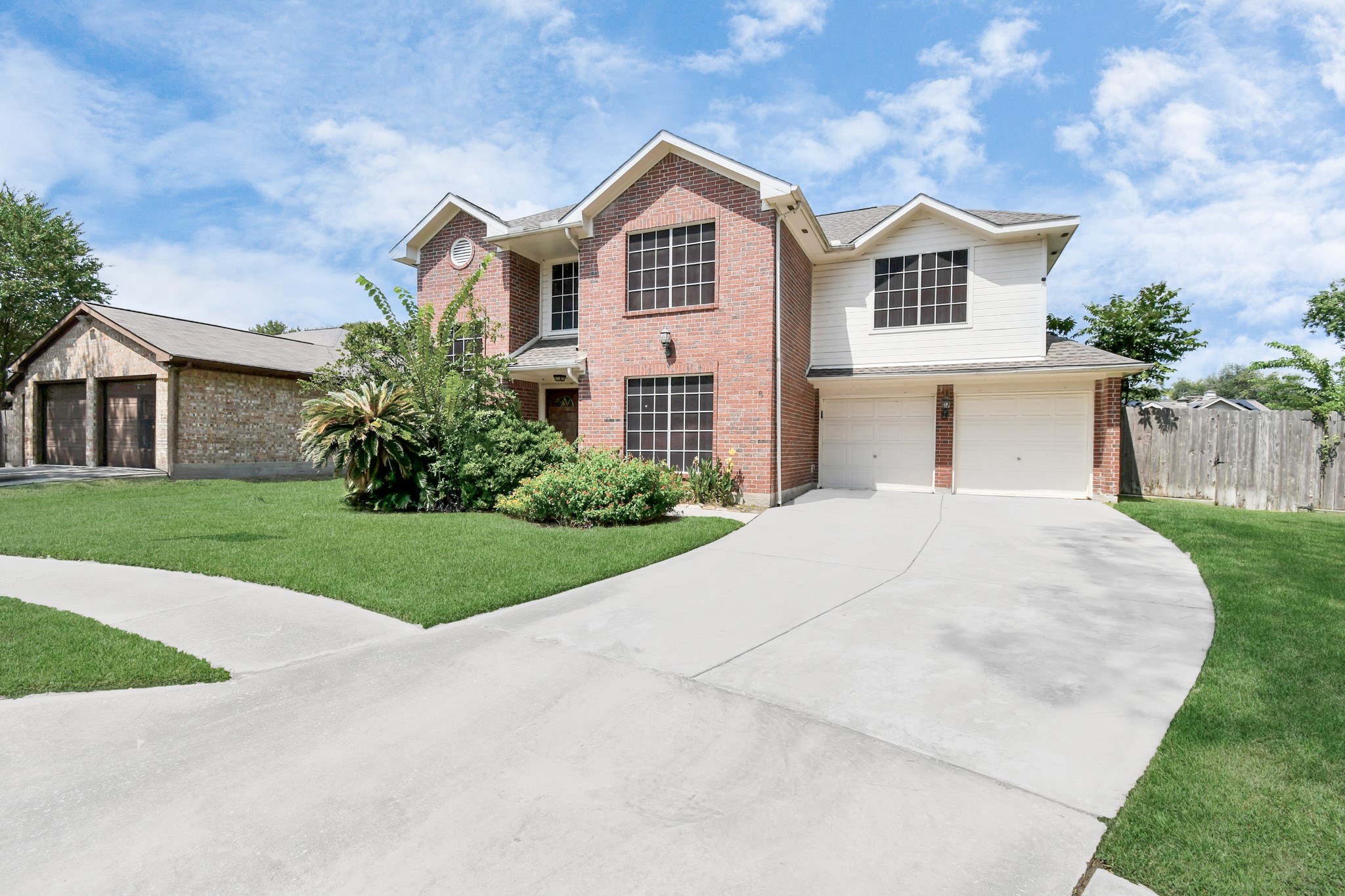 3402 Haydee Road Spring, TX 77388 - Photo 2 of 26 a front view of a house with a yard and garage