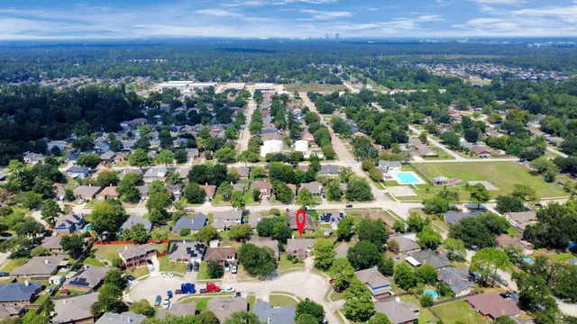 an aerial view of a house with swimming pool yard and outdoor seating