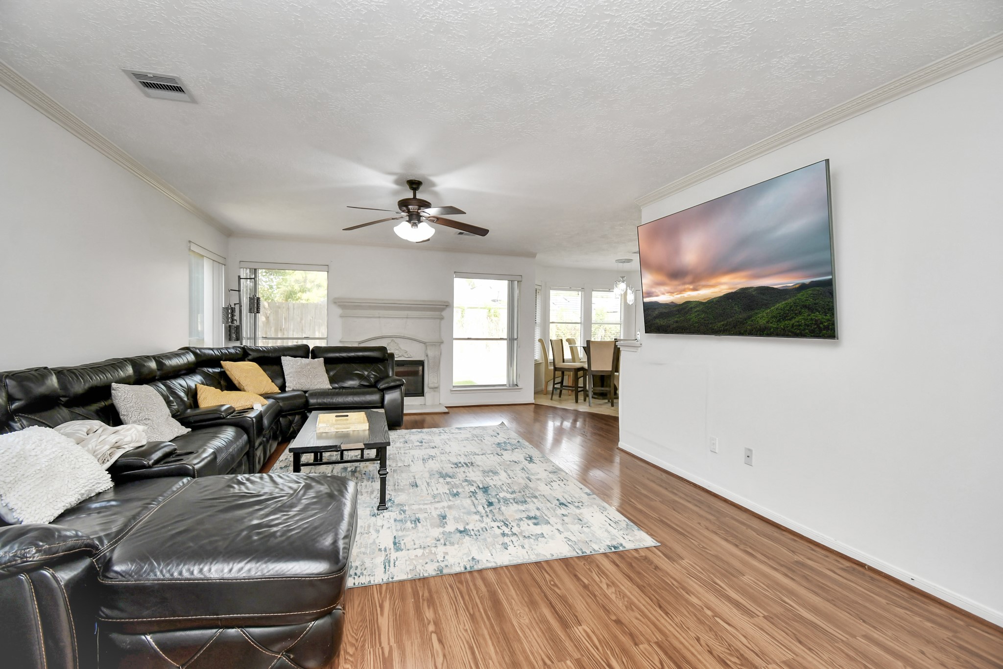 3402 Haydee Road Spring, TX 77388 - Photo 6 of 26 a living room with furniture a flat screen tv and kitchen view