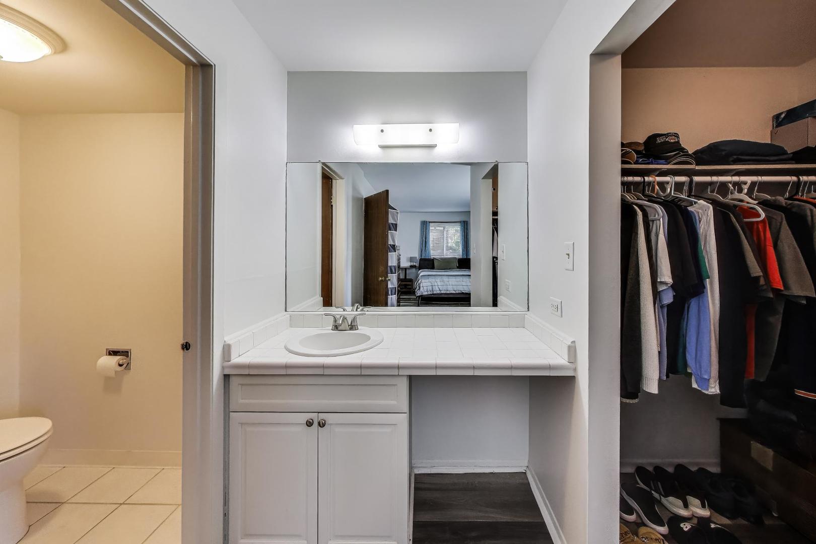 3412 Donovan Drive, Unit 1 Crete, IL 60417 - Photo 14 of 23 a bathroom with a sink and a mirror