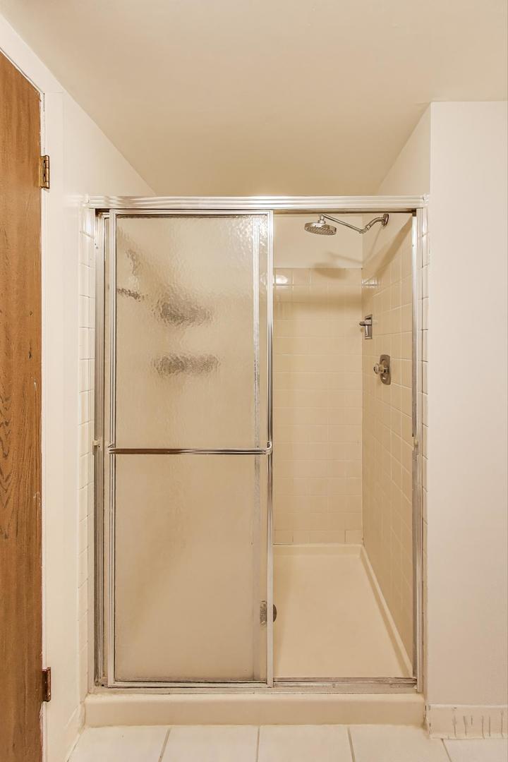 3412 Donovan Drive, Unit 1 Crete, IL 60417 - Photo 15 of 23 a bathroom with a shower