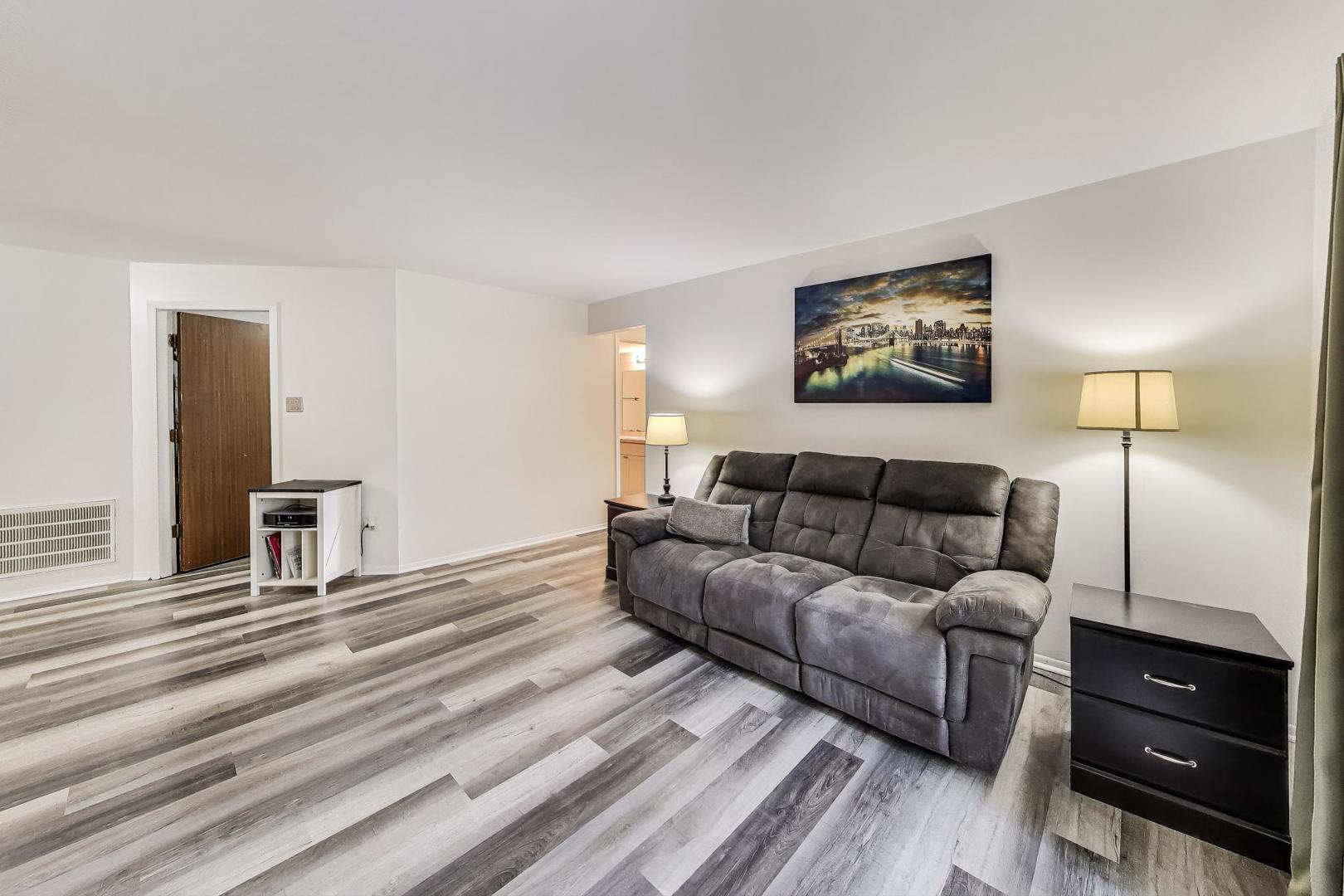 3412 Donovan Drive, Unit 1 Crete, IL 60417 - Photo 3 of 23 a living room with furniture and a flat screen tv