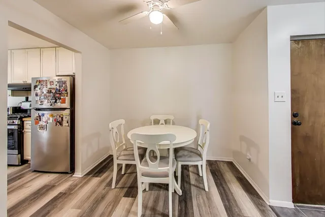a view of a dining room with furniture and wooden floor