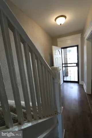 a view of washer and dryer with wooden floor