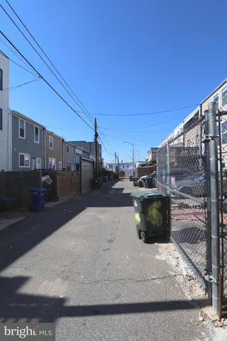 a view of city street with parked cars