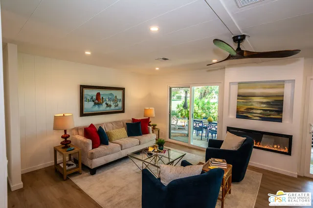 a living room with furniture and a window