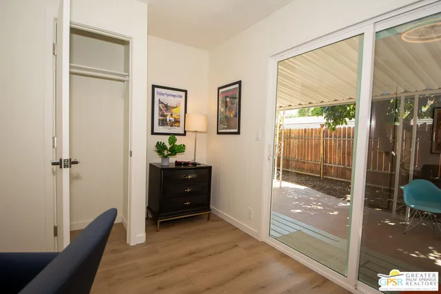 a view of a livingroom with furniture and a window