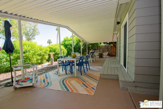 a balcony with furniture and garden