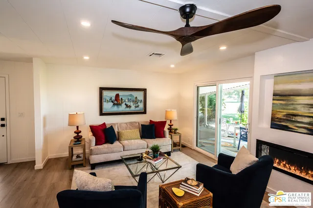 a living room with furniture and a window