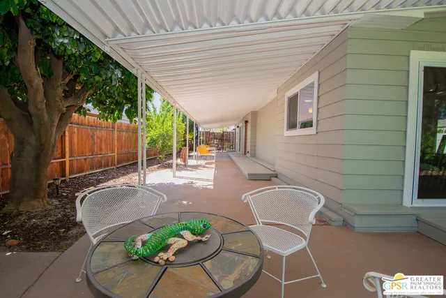 a outdoor space with the couches and dining chair