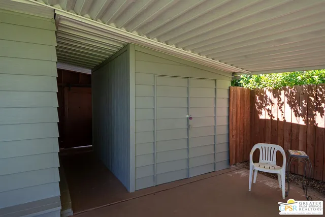 a view of a grassy field with trees