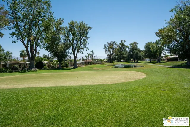 a view of swimming pool and outdoor seating