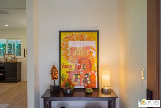 a view of a living room with a table and a potted plant