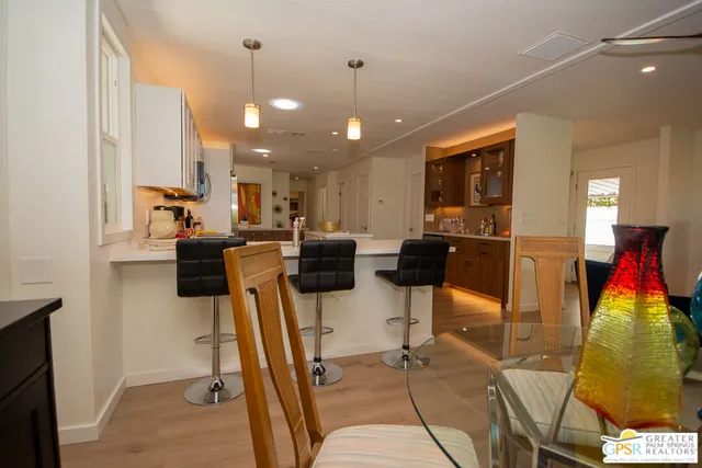 a lobby with furniture and a chandelier