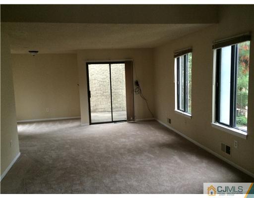 281 Rector Street Perth Amboy, NJ 08861 - Photo 3 of 10 a view of an empty room with a window