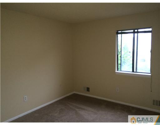 281 Rector Street Perth Amboy, NJ 08861 - Photo 5 of 10 an empty room with a window