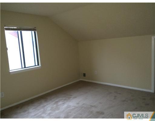 281 Rector Street Perth Amboy, NJ 08861 - Photo 6 of 10 an empty room with a window