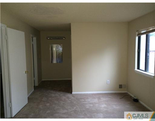 281 Rector Street Perth Amboy, NJ 08861 - Photo 7 of 10 a view of an empty room and window