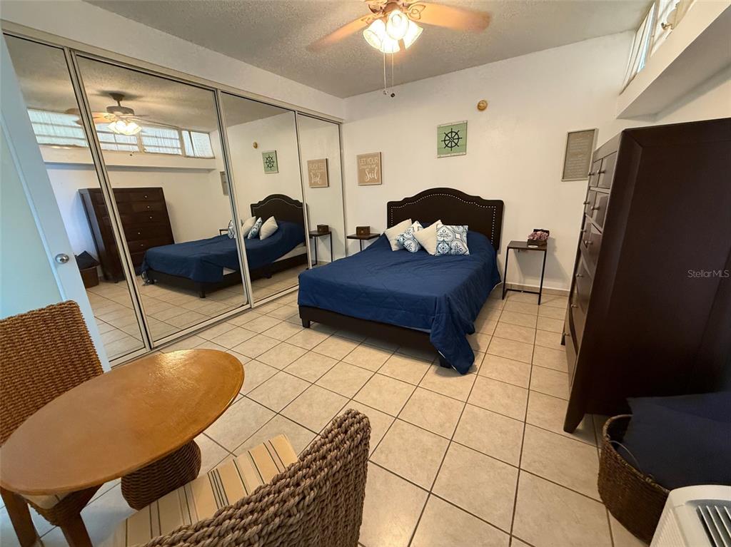 Condo Pelican Reef Condo Pelican Reef, Unit 302 Rincon, PR 00677 - Photo 6 of 16 a living room with furniture and a window