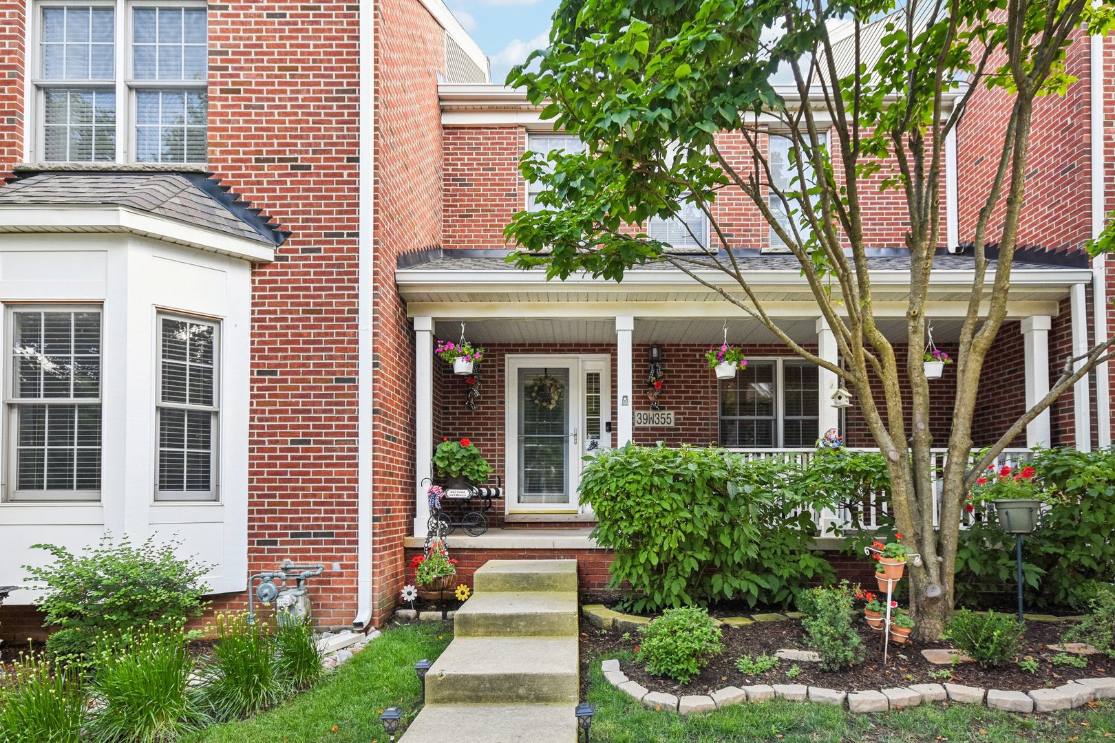 39W355 Baker Drive Geneva, IL 60134 - Photo 1 of 22 a front view of a house with garden