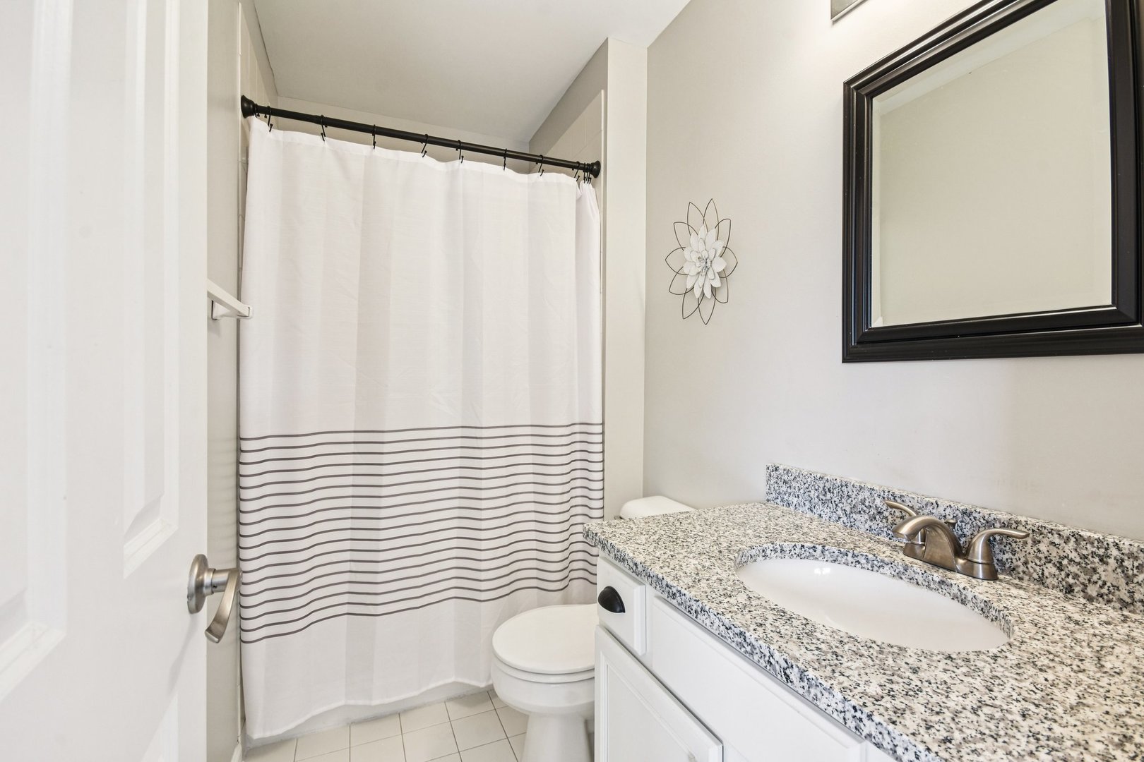39W355 Baker Drive Geneva, IL 60134 - Photo 18 of 22 a bathroom with a granite countertop sink toilet and mirror