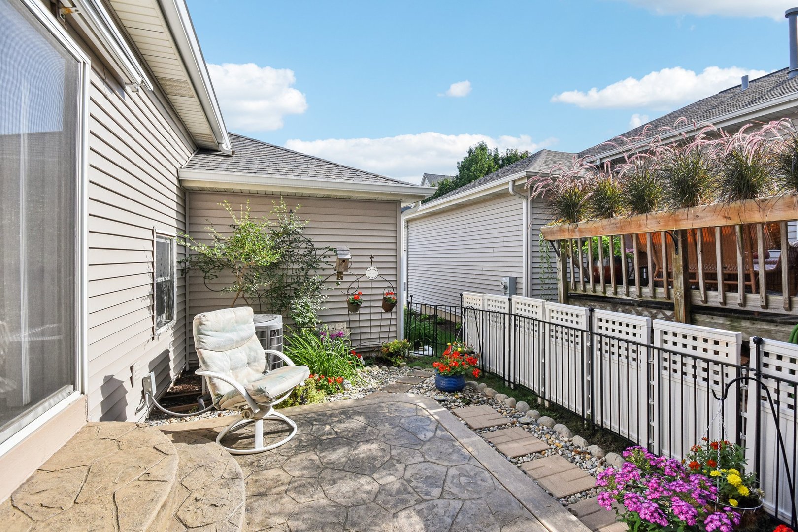 39W355 Baker Drive Geneva, IL 60134 - Photo 21 of 22 a view of a chair and tables in the back yard of the house