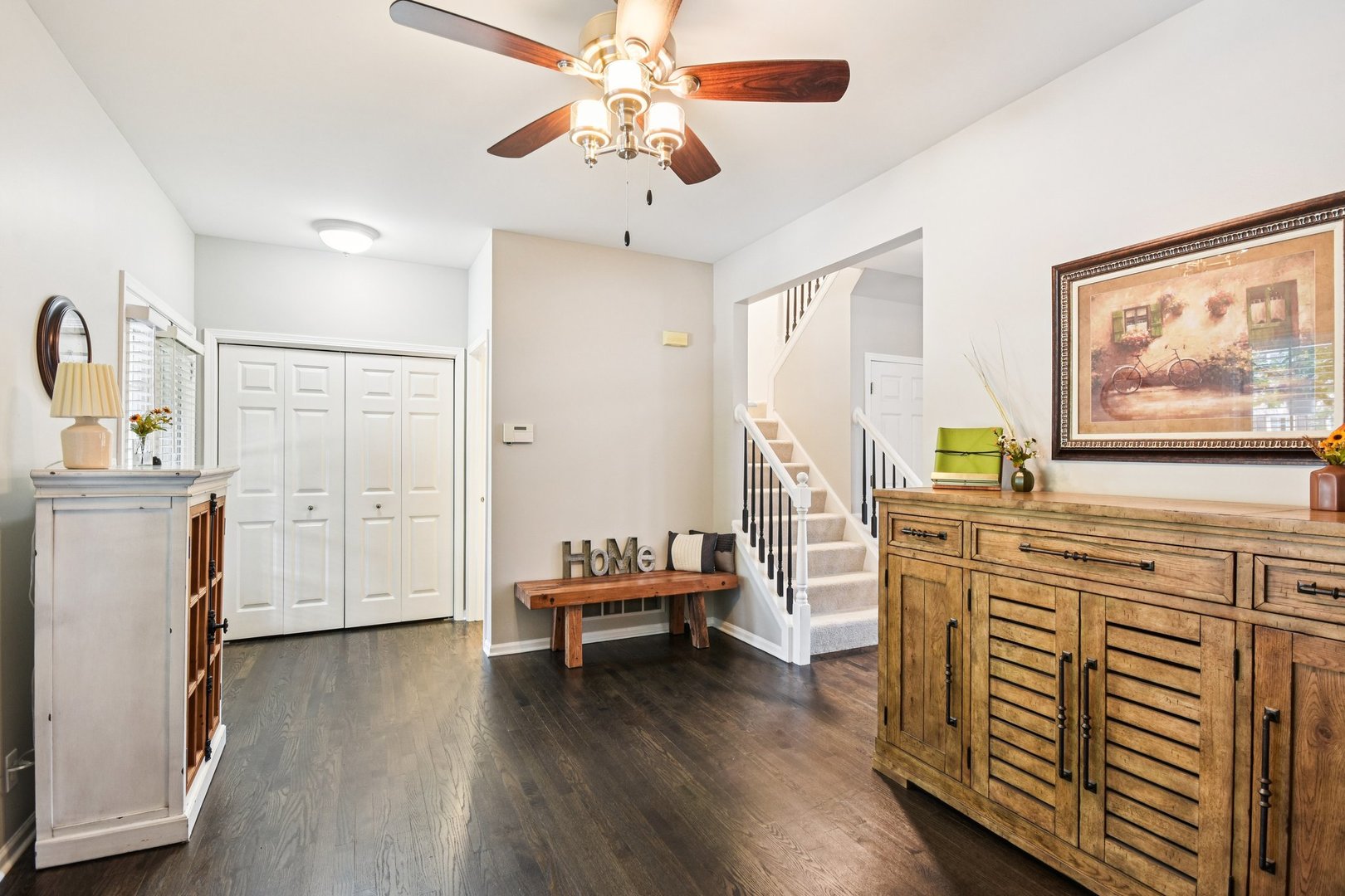 39W355 Baker Drive Geneva, IL 60134 - Photo 3 of 22 a view of a livingroom with furniture hardwood floor and a ceiling fan