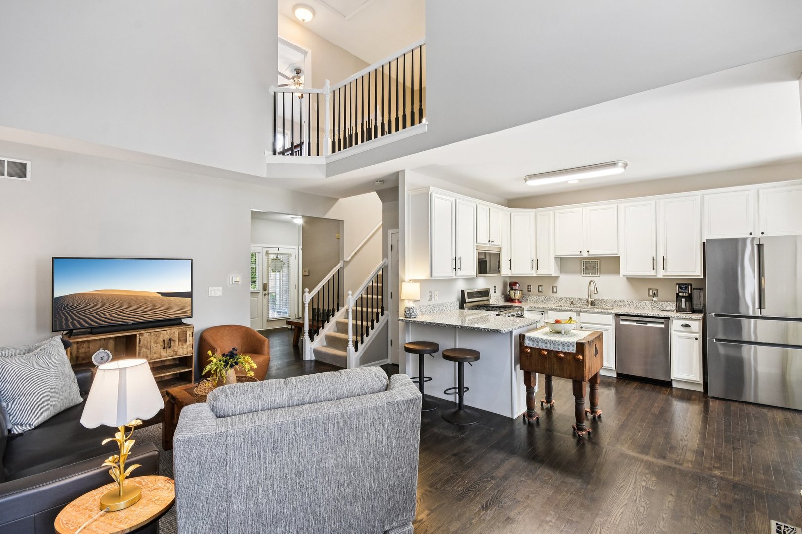 39W355 Baker Drive Geneva, IL 60134 - Photo 6 of 22 a living room with furniture a rug and kitchen view