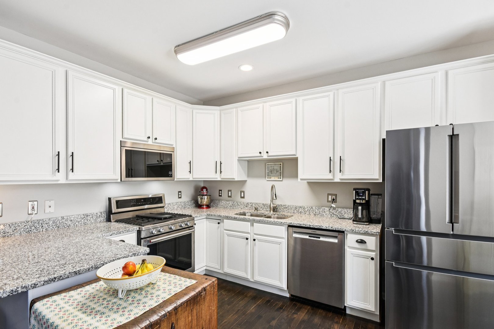 39W355 Baker Drive Geneva, IL 60134 - Photo 7 of 22 a kitchen with stainless steel appliances granite countertop a refrigerator stove microwave and sink