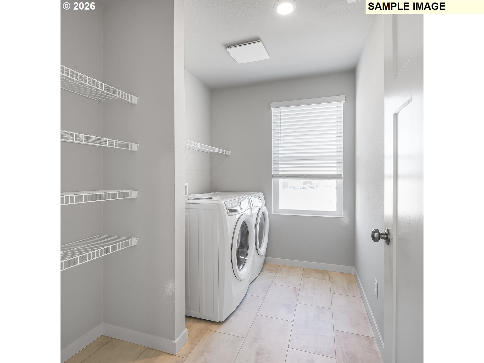 31775 Northwest Timeric Drive North Plains, OR 97133 - Photo 20 of 21 a utility room with cabinets washer and dryer