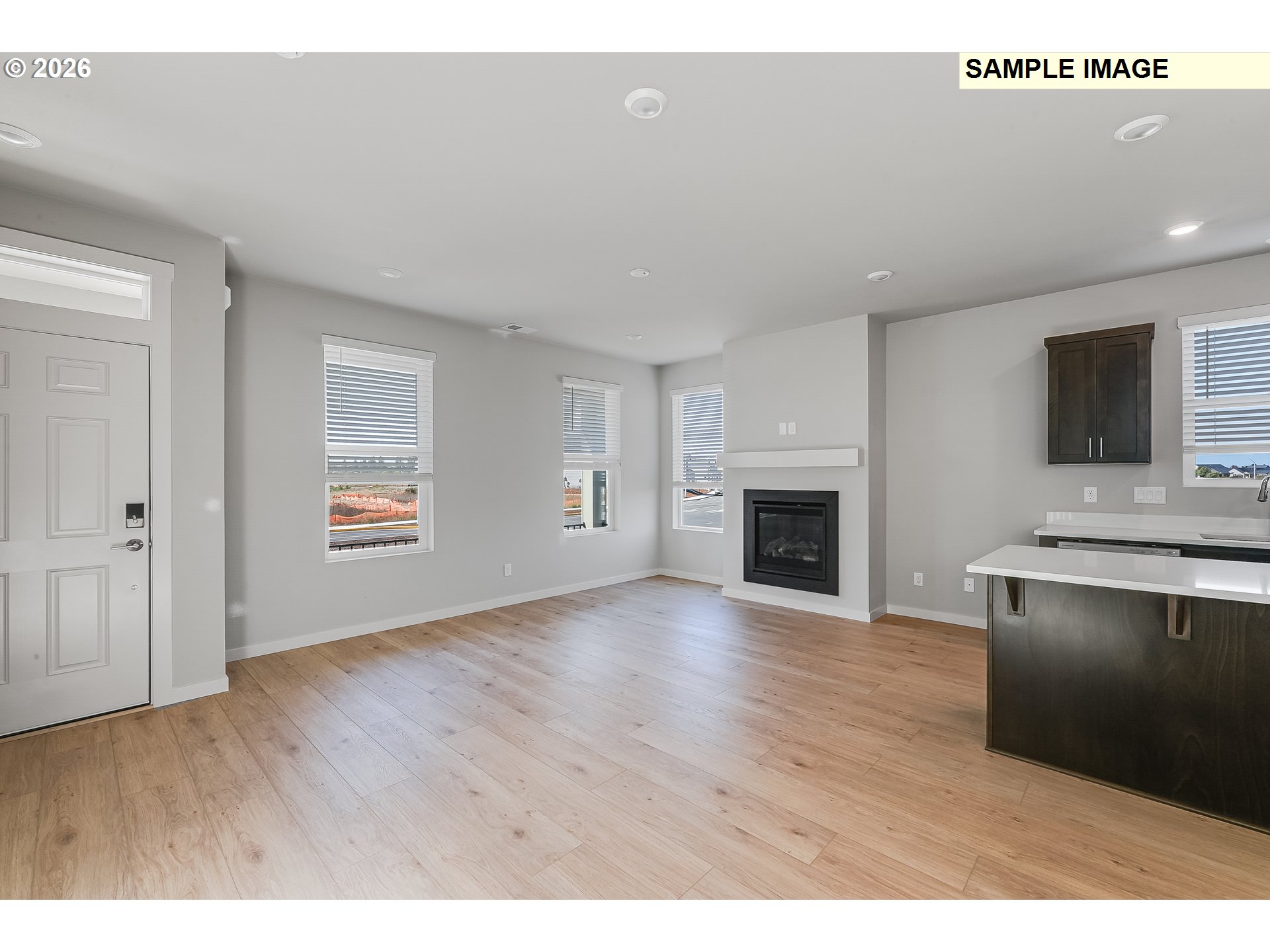 31775 Northwest Timeric Drive North Plains, OR 97133 - Photo 9 of 21 a view of empty room with wooden floor and fireplace