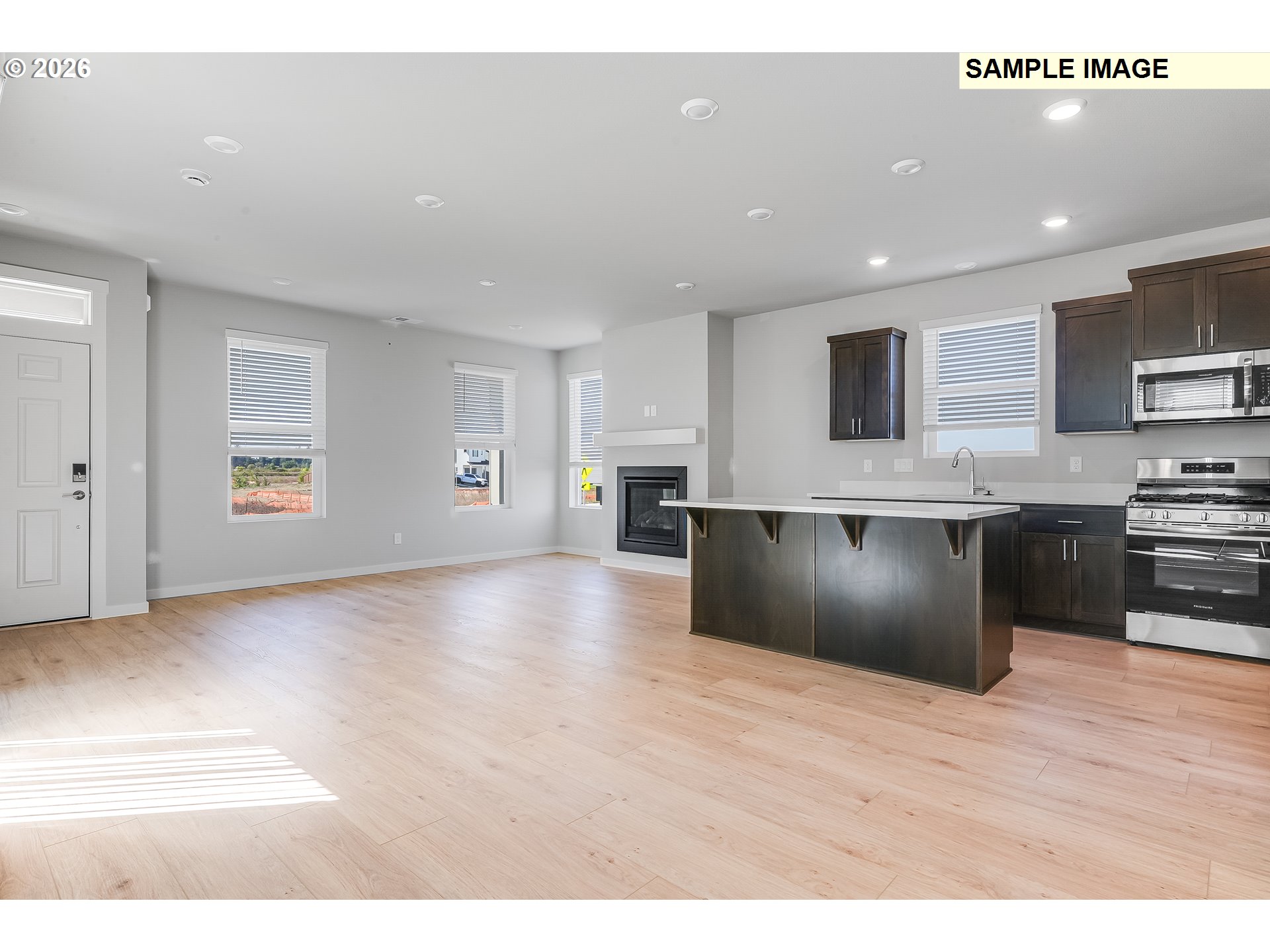 31775 Northwest Timeric Drive North Plains, OR 97133 - Photo 10 of 21 a large kitchen with stainless steel appliances granite countertop a stove a sink and a refrigerator