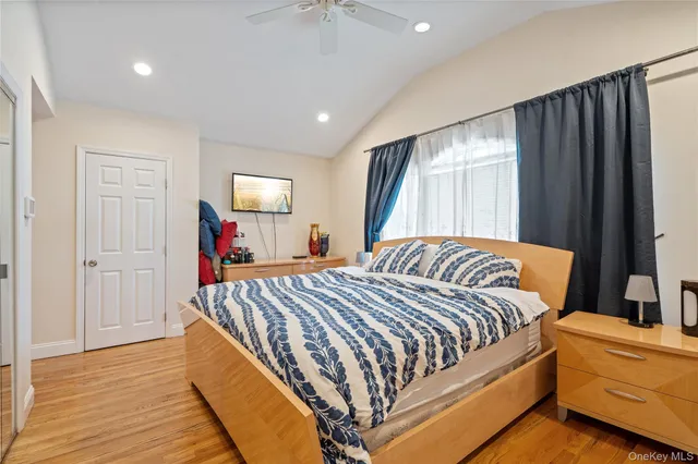 a bedroom with bed and window