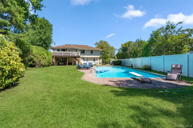 a view of a house with a yard porch and sitting area
