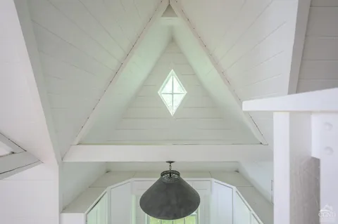 a view of a hallway to a bedroom