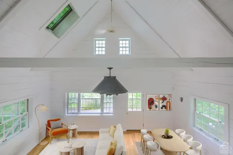 kids bedroom with furniture and a window