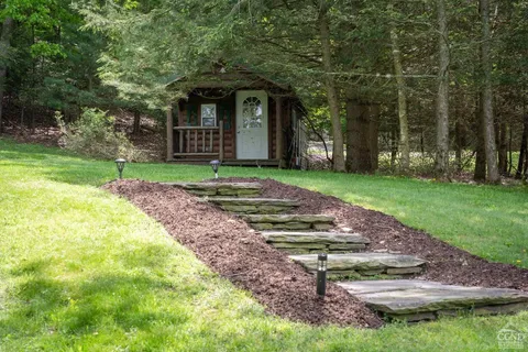 front view of a house with a yard