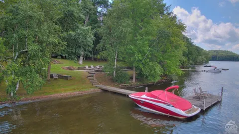 a view of a park with large trees