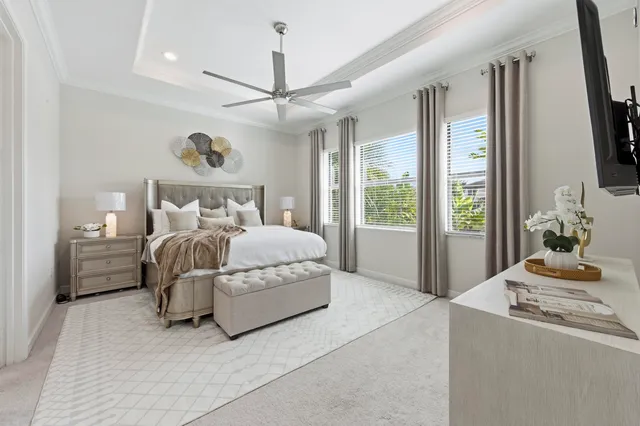 a front view of a house with a yard and potted plants