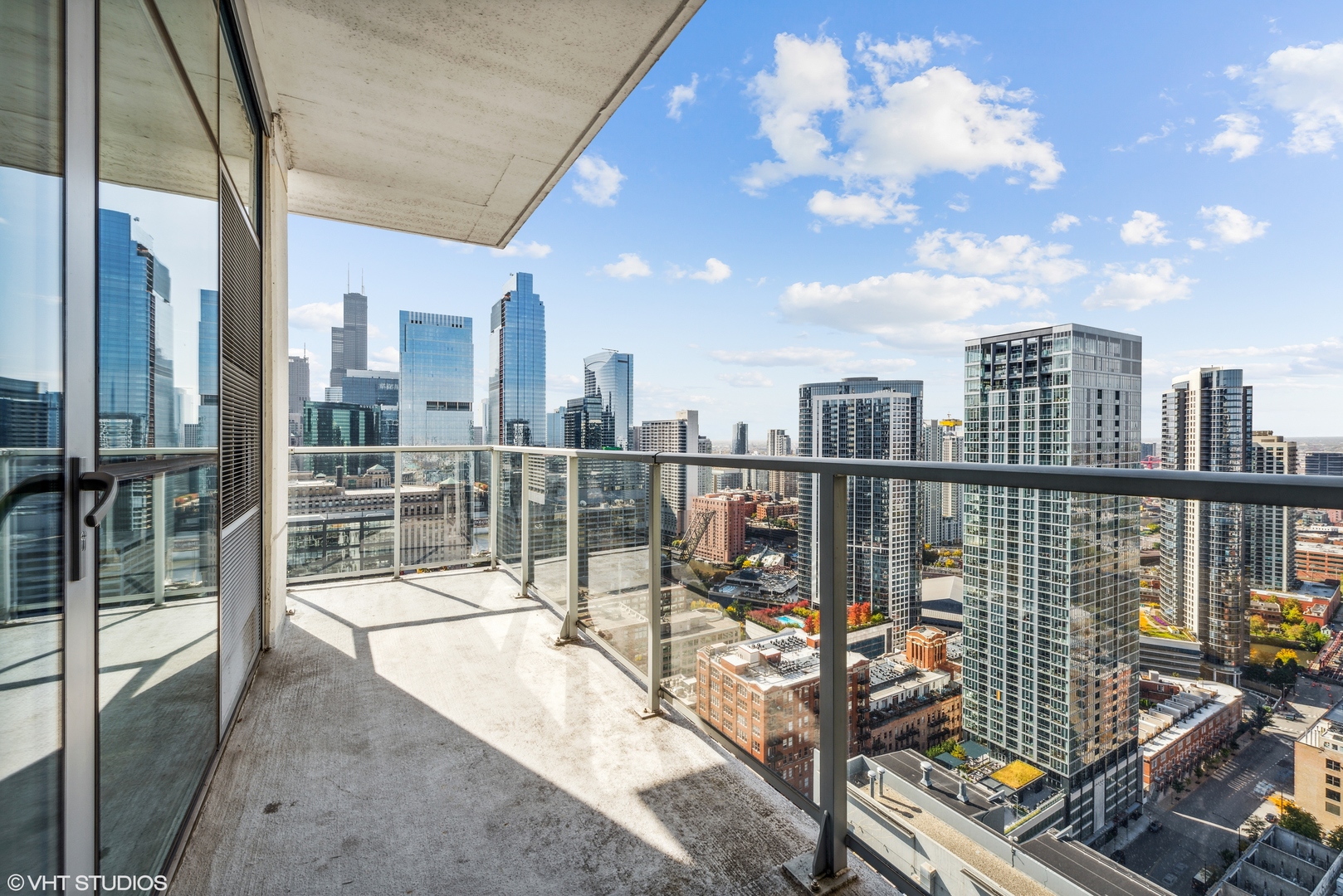 Undisclosed Address Chicago, IL 60654 - Photo 15 of 22 a view of a balcony with wooden floor