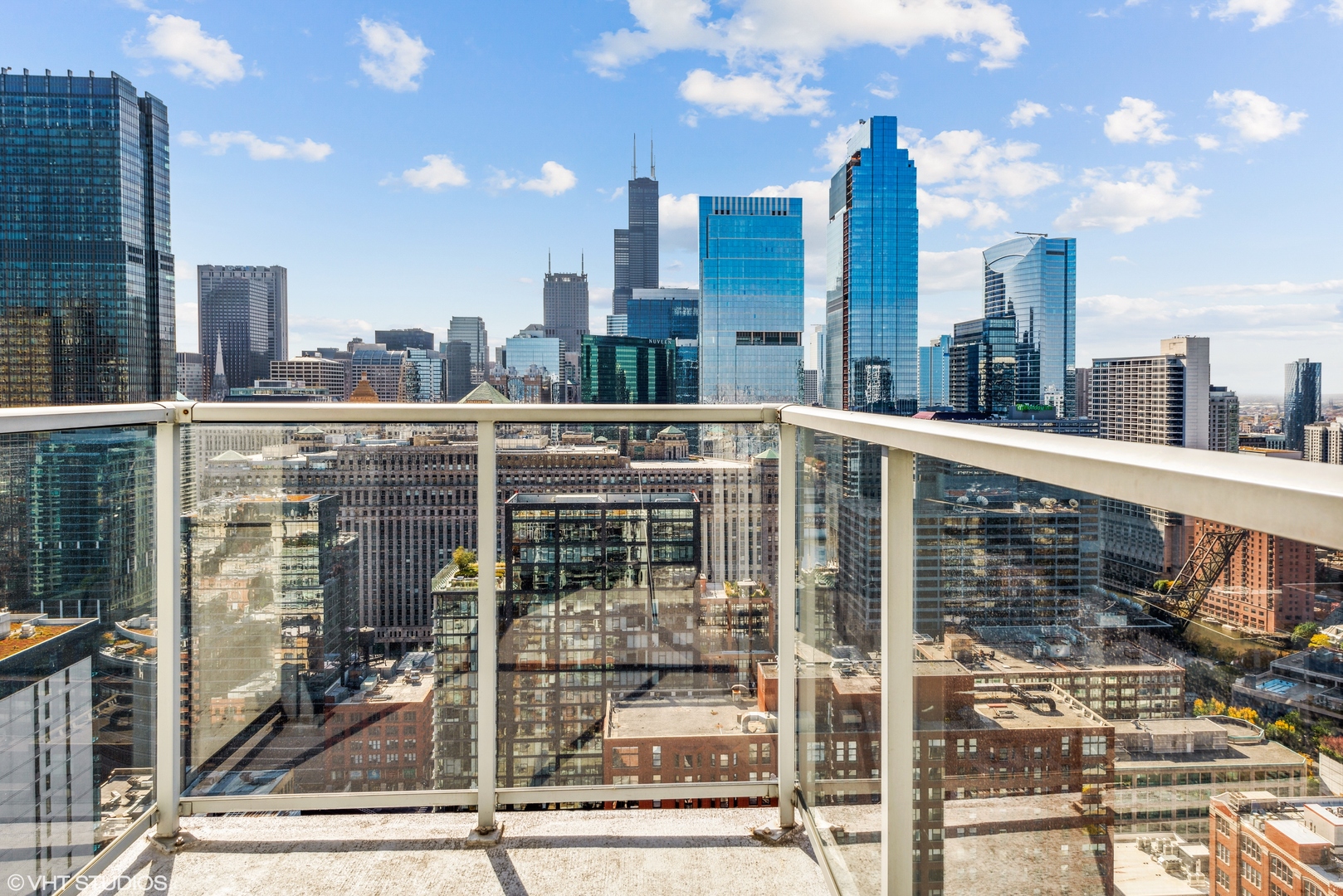 Undisclosed Address Chicago, IL 60654 - Photo 16 of 22 a view of a city from a balcony