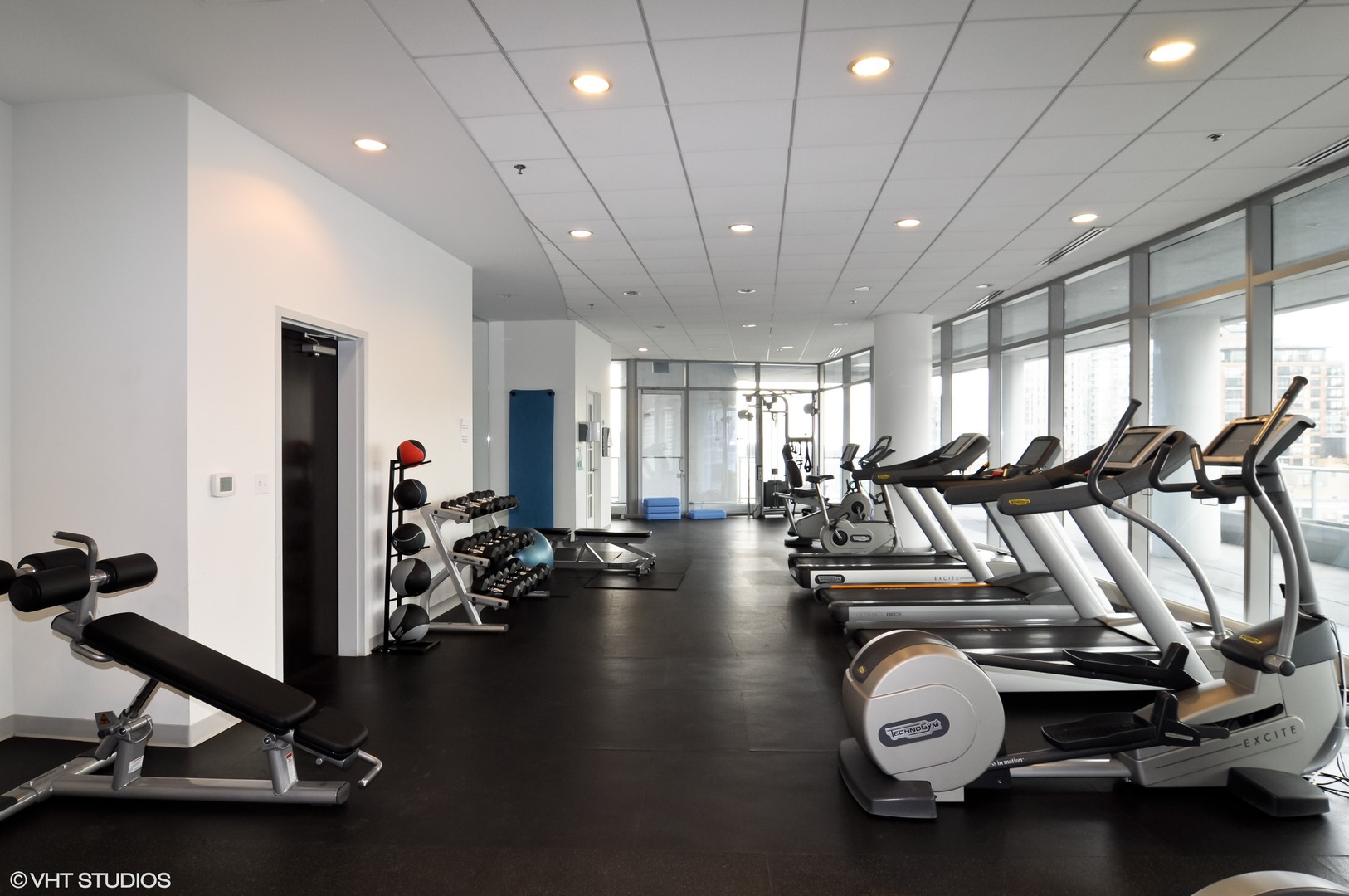 Undisclosed Address Chicago, IL 60654 - Photo 20 of 22 a view of a room with gym equipment